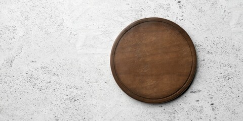 Rustic empty round wooden cutting or chopping board on concrete table background flat lay top view from above with copy space