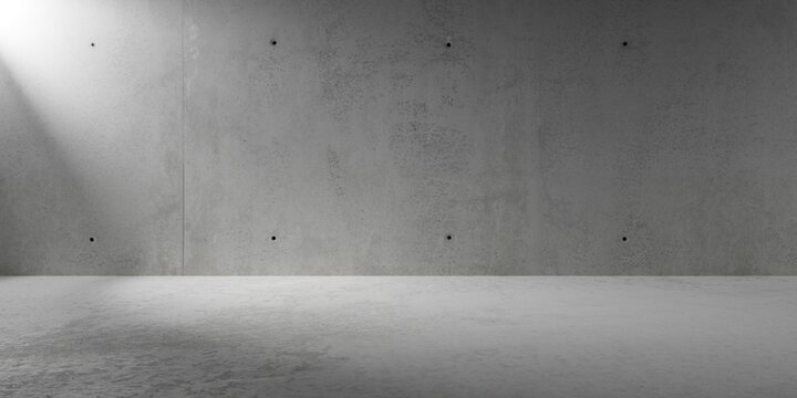 Abstract empty, modern concrete room with spotlight or sunlight shafts on the back wall and rough floor - industrial interior background template
