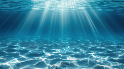 Sandy sea bottom illuminated with bright sun rays