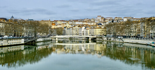 Saone river in french Lyon town with the "Croix Rousse" hill on the background.