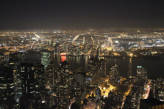 Panoramic aerial view of Manhattan at night in New York City, NY, USA