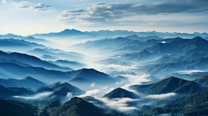 Foto op Canvas A rolling mountain range in the early morning mist, the peaks emerging and disappearing as the fog s © ProVector