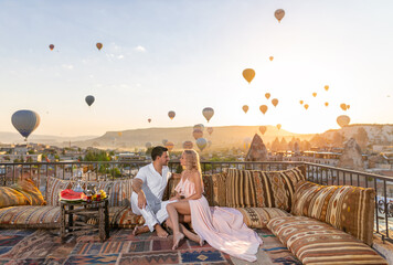 Beautiful morning in Cappadocia - a young couple and their romantic breakfast with an amazing...