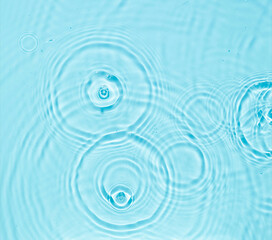 Abstract water surface cosmetic background with rings. Spa concept. Splash cosmetic moisturizer...