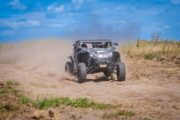 UTV in action offroad vehicle racing on sand dune. Extreme, adrenalin. 4x4.