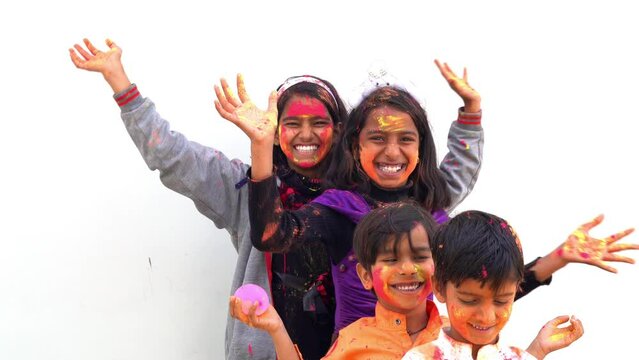 Happy india kids playing holi with water balloon. Holi celebrations in India.