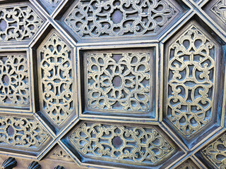 close up details of a traditional Moroccan copper and metal door at the Mohammed V mausoleum in...
