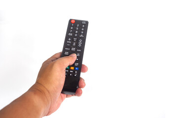 Hand pressing remote control isolated on white background