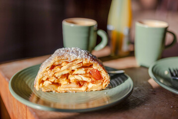 Cup of coffee with an Apfelstrudel