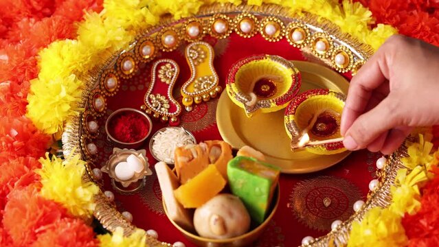 Onam Diwali vishu celebration Indian festival flowers marigold flowerbed lighted oil lamp Nilavilakku Diya colors Rangoli decoration greetings Dipavali Kerala Tamil nadu North India Mumbai Delhi India