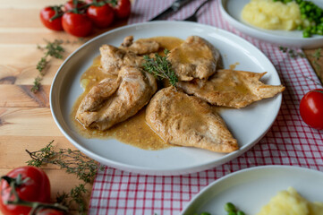 Chicken breast with milk, butter sauce. Delicious italian meal