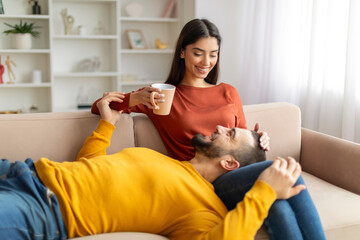 Obraz premium Romantic young couple enjoying time together at home