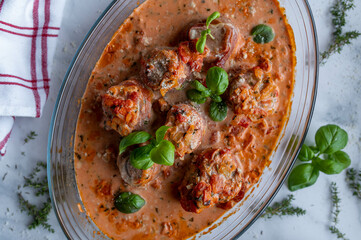 Pork tenderloin wrapped with italian parma ham in a delicious tomato cream sauce.