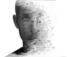 A disappearing black and white double exposure portrait of a man. - 739349347