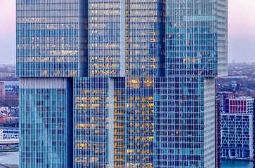 Rotterdam, The Netherlands, February 12, 2024: facade of De Rotterdam building, with apartments, offices and hotel, during evening twilight