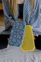 Women's hands hold a meditation board. Rest and relaxation with yoga.