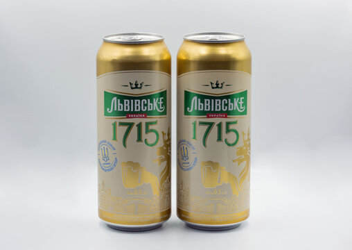 Lvivske 1715 Ukrainian lager beer cans closeup on white.