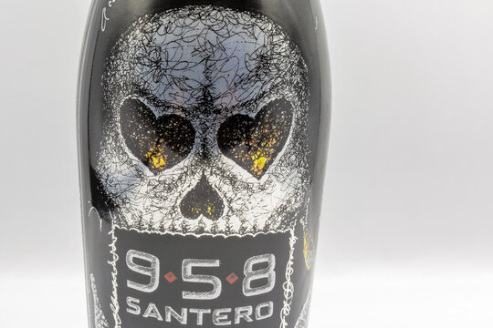 Italian 958 Santero extra dry sparkling wine bottle closeup against white.