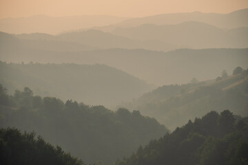 View of distant mountains and hills at sunset
