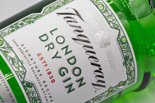 Tanqueray London dry gin bottle label closeup against white.