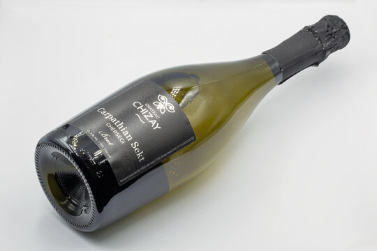 Chizay Carpathian Sekt Chersegi sparkling wine bottle closeup against white.