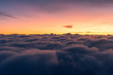 Sunrise above the clouds on a flight from Washington DC to Austin Texas 