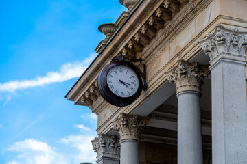 Fototapeta na wymiar Timeless Elegance: Classical Clock on Ornate Column