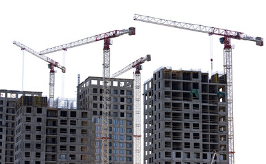 Fototapeta na wymiar four cranes above grey unfinished block houses