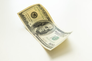 The one hundred dollars close up isolated on a white background