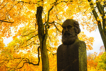 Statue of a person in autumn park, Stockholm, Sweden