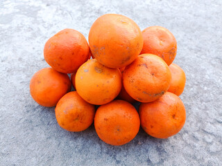 Fresh orange fruits on the floor