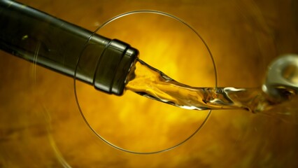 Freeze Motion Shot of White Wine Pouring, Unique Angle of View from the Bottom of the Glass