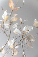 pastel leaves and flowers with silver and gold kintsugi patterns on a branch