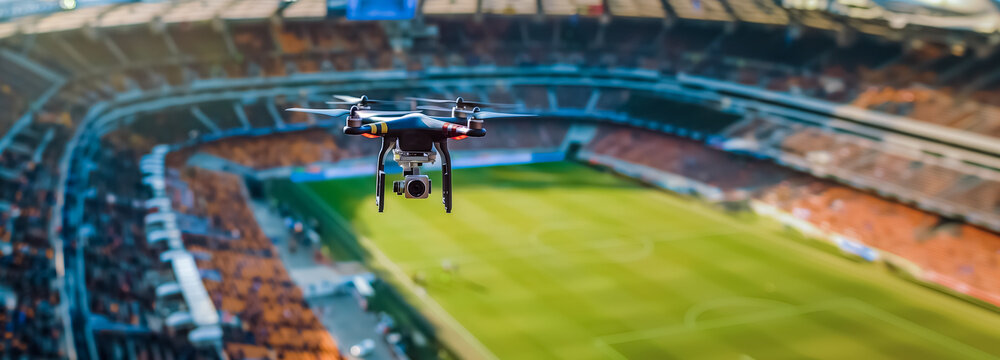 un drone de la police survole un stade de football pour de la surveillance