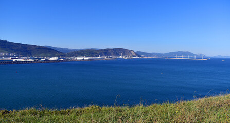 Fototapeta na wymiar Port of Bilbao seen from Getxo. To the right the Wind Farm. Basque Country. Spain
