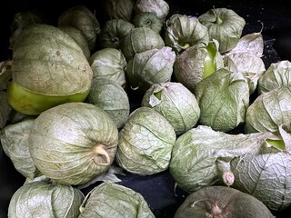 Tomatillos on display at a grocer