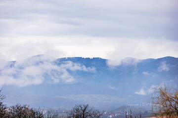 View from Marktgräflerland in the Rhine Valley to the cloud-covered mountains of the Black Forest