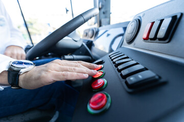 Bus driver sitting in his bus on tour. City bus cabin interior. Transport, transportation, tourism,...