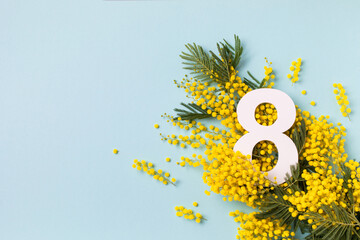 8 March celebration with number eight decorated with spring mimosa flowers top view. Happy Women Day festive background. - obrazy, fototapety, plakaty