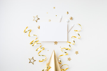 Birthday party template with empty paper blank and golden decoration top view. Festive holiday minimal party invitation.