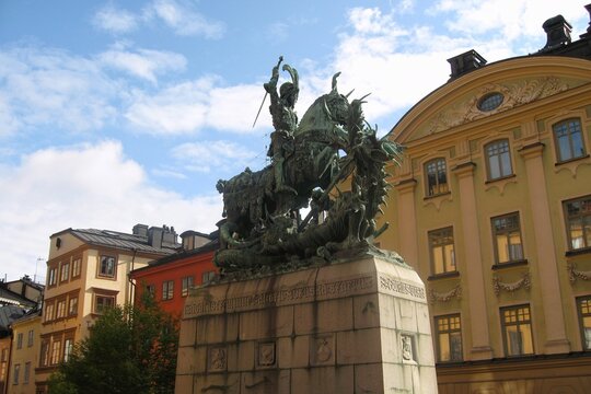 Bronze statue of Saint George and the Dragon at medieval Gamla Stan district. Sankt G&ouml;ran och Draken sculpture at old town. Stockholm, Sweden - August 19, 2008