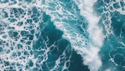 Fototapeta premium aerial view of beautiful photo of blue water flowing in waves with white foam in a ocean. 