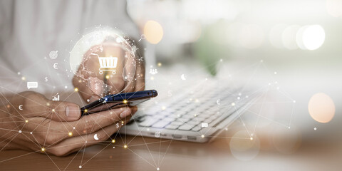 E-commerce or online shopping concept. businessman uses a smartphone to browse an online shopping...