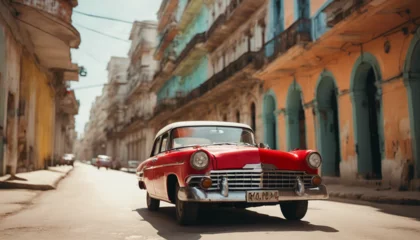 Rucksack retro red car on a sunny street in havana, cuba  © abu