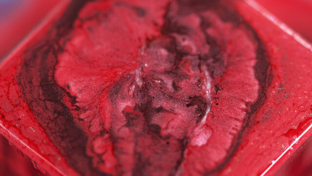 Abstract background. Glitter dye. Shiny liquid mix. Vivid red burgundy color ink shimmering particles grain texture paint wave spreading on square surface. - Powered by Adobe