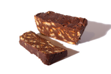 Chocolate salami dessert made from cocoa and broken biscuits. Isolated on a white background.