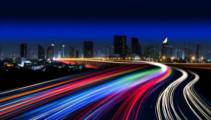 Fototapeta premium A long exposure photo of a city skyline at night, with streaks of light from cars on a highway leading towards the illuminated buildings.