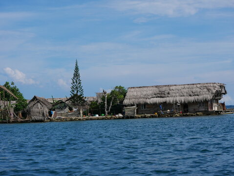 indigenous straw houses (original peoples) on a Caribbean island, Guna Yala territory (San Blas Islands, Panama)