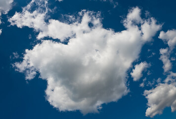 Big fluffy white cloud in blue sky