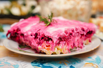 Russian salad herring under a fur coat with beetroot on the New Year's table